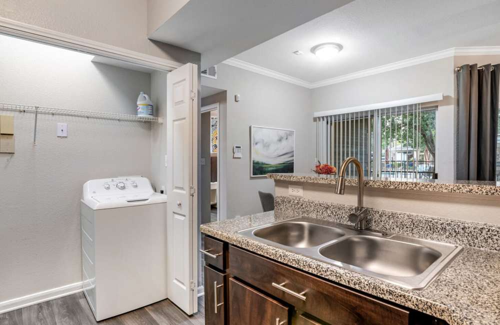 Washer and dryer at Hollister Place Apartments in Houston, Texas