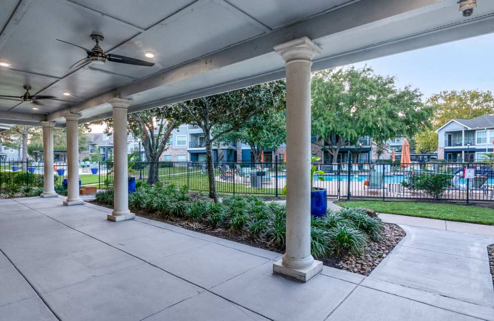 View of the neat and clean surroundings of pool at Hollister Place Apartments in Houston, Texas