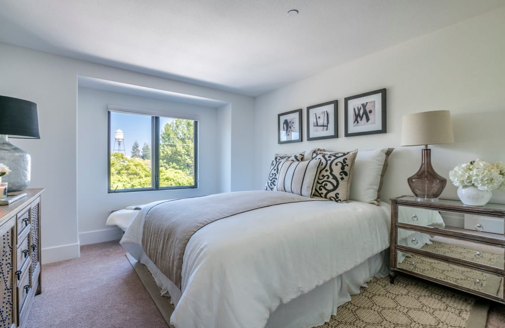 Cozy master bedroom in a model home at Orchard City Lofts in Campbell, California