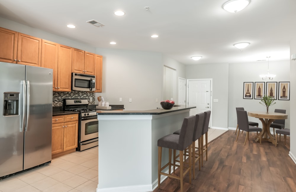 Fully equipped kitchen with a breakfast bar at Cranford Crossing Apartment Homes in Cranford, New Jersey
