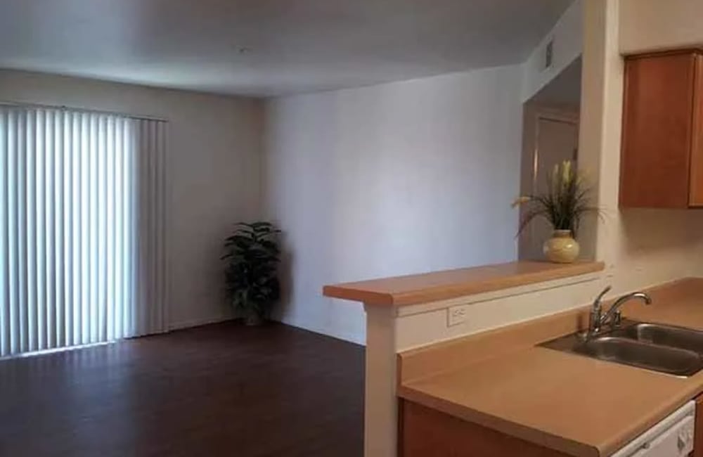 Kitchen and living room at Santa Fe Apartments in Bakersfield, California