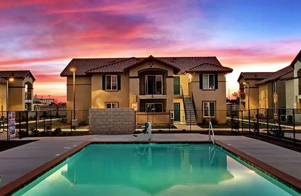 Swimming pool at sunset at Cordova Apartments in Selma, California