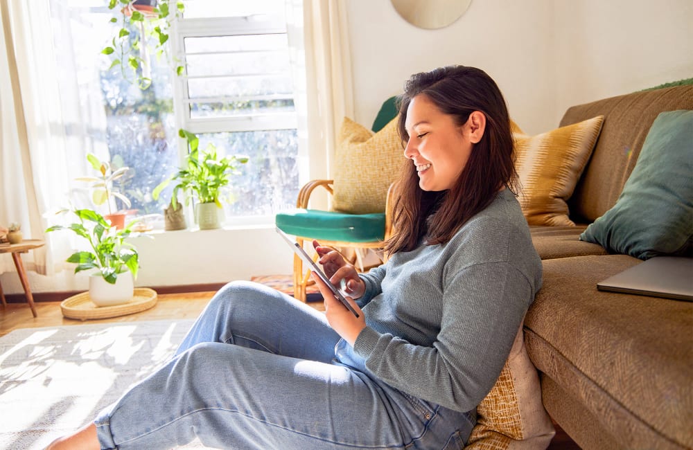 Woman checking her iPad at Montecito Terraces in Panorama City, California