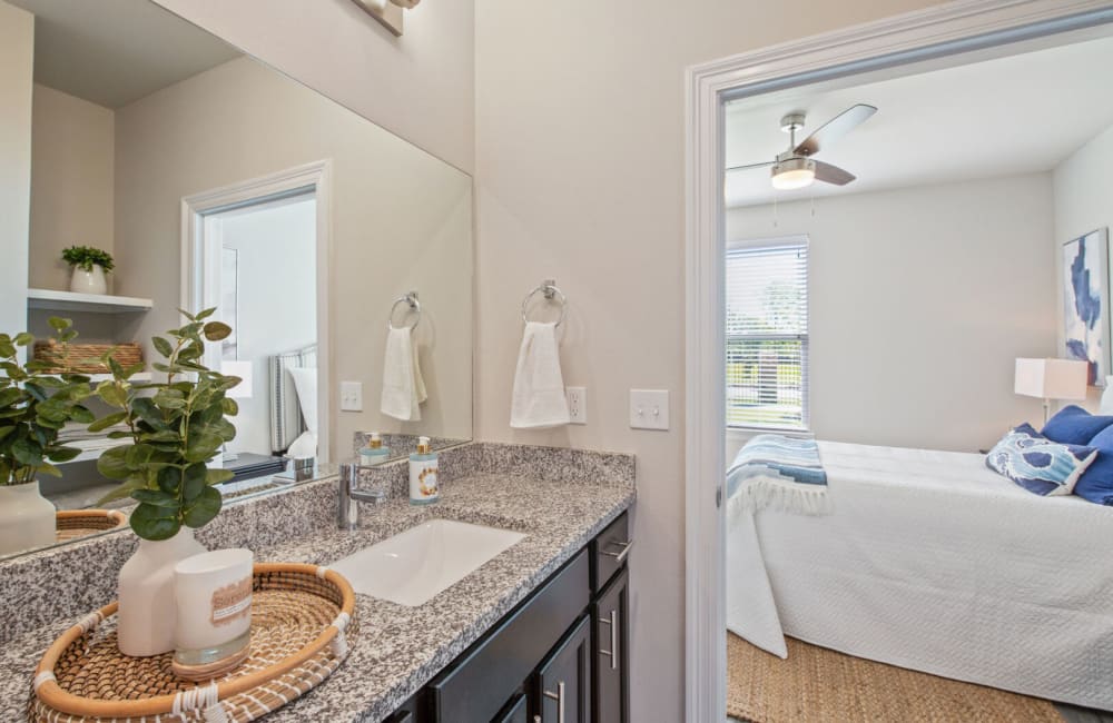 Bathroom with granite countertop at The Waters at Hammond in Hammond, Louisiana