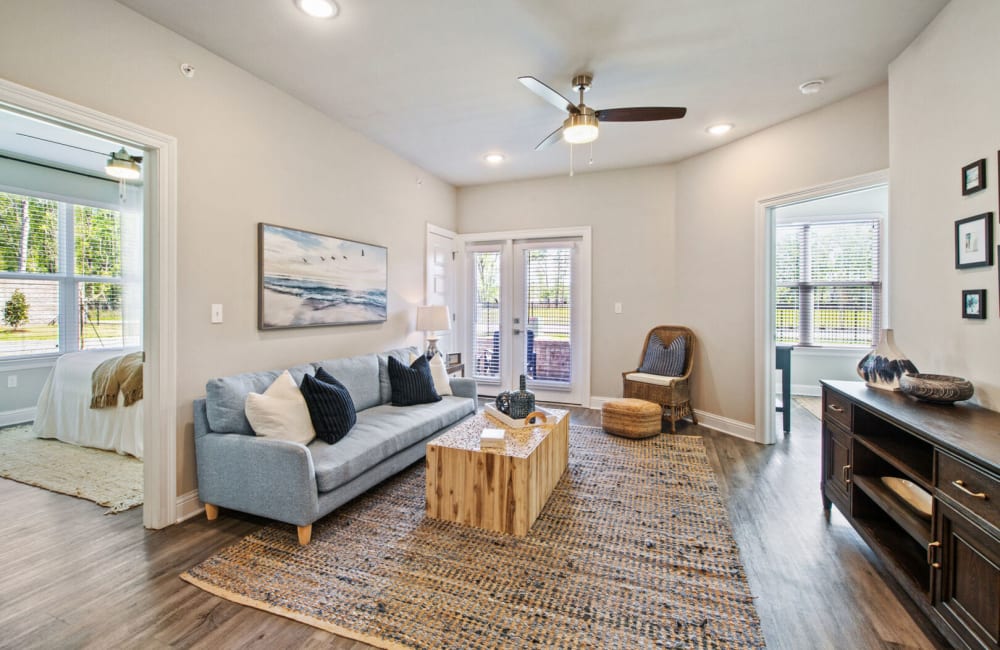 Living space with large rug at The Waters at Hammond in Hammond, Louisiana