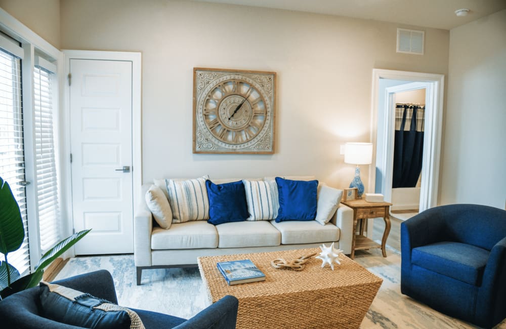 Model living space with couch at The Waters at Ransley in Pensacola, Florida
