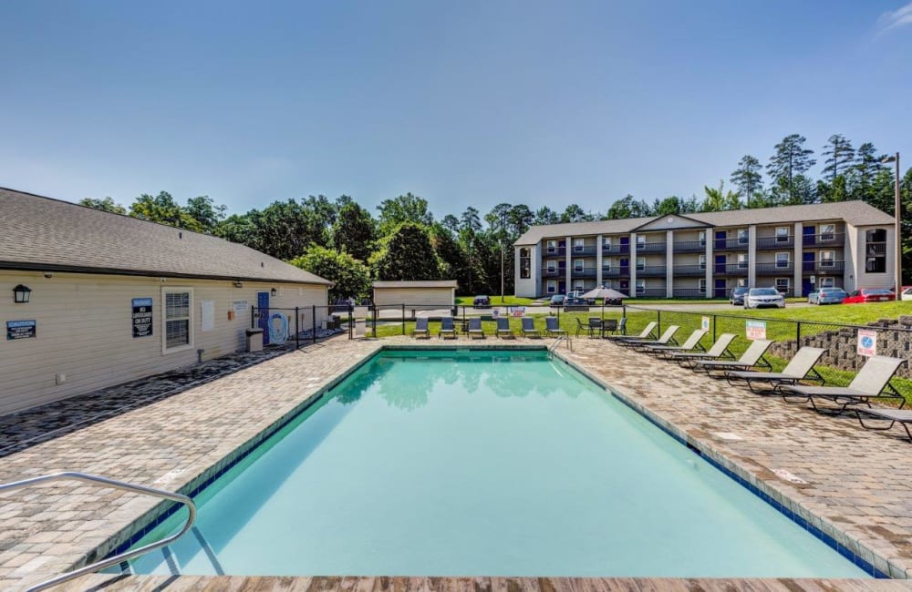 Beautiful blue sky with a luxurious pool Kannan Station Apartment Homes in Kannapolis, North Carolina