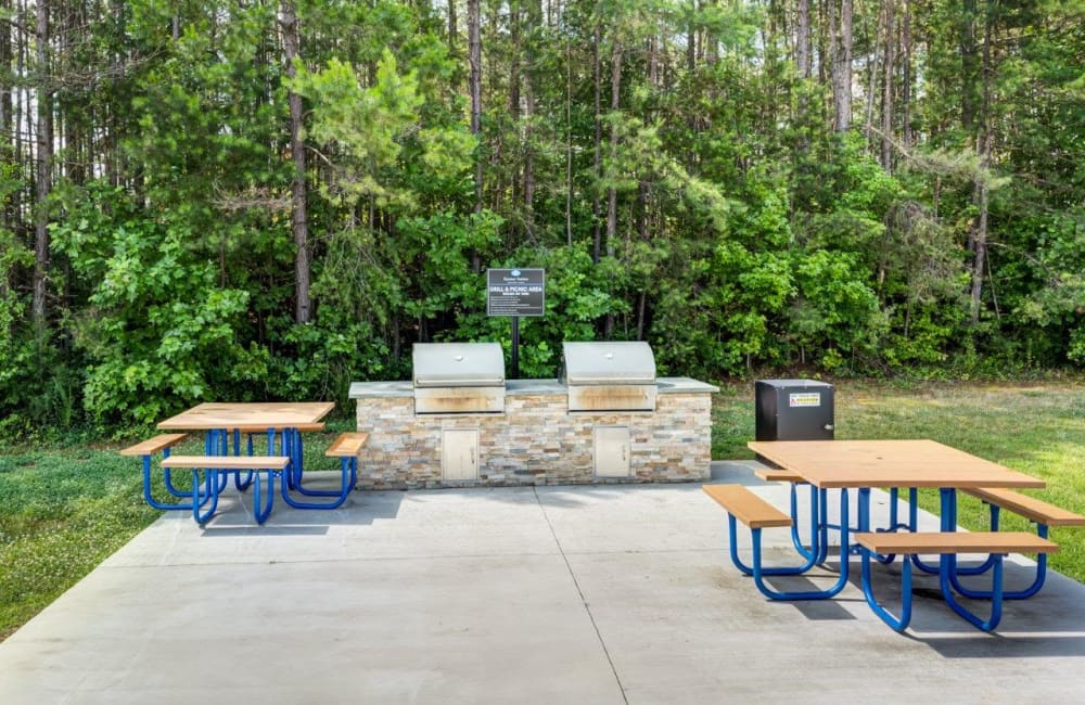 Outdoor grilling area to use at our apartments located at Kannan Station Apartment Homes in Kannapolis, North Carolina