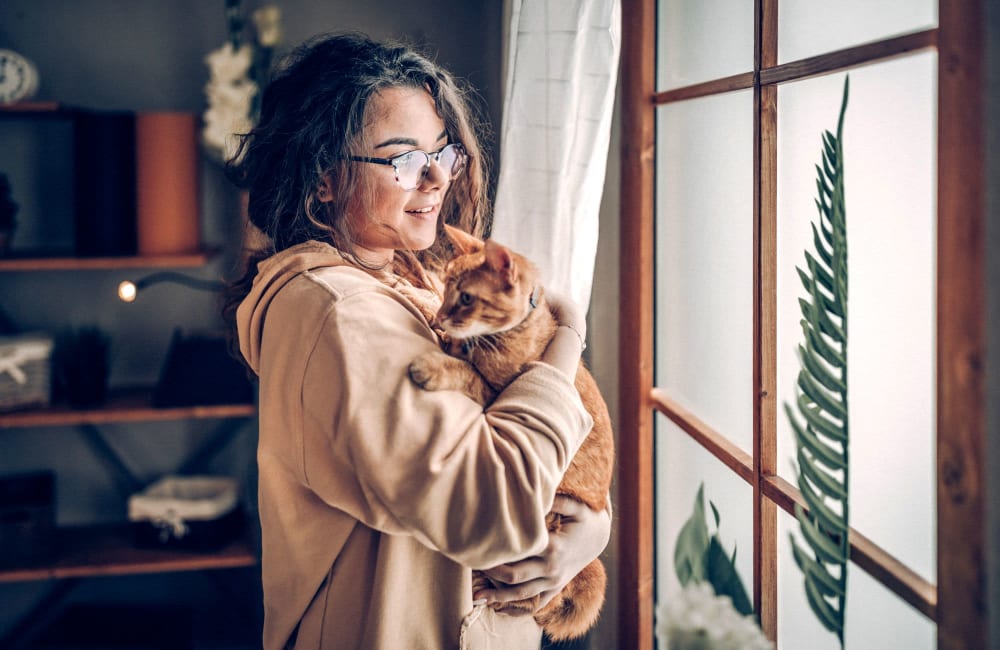 Woman holding her cat at Gramercy Apartments in San Diego, California