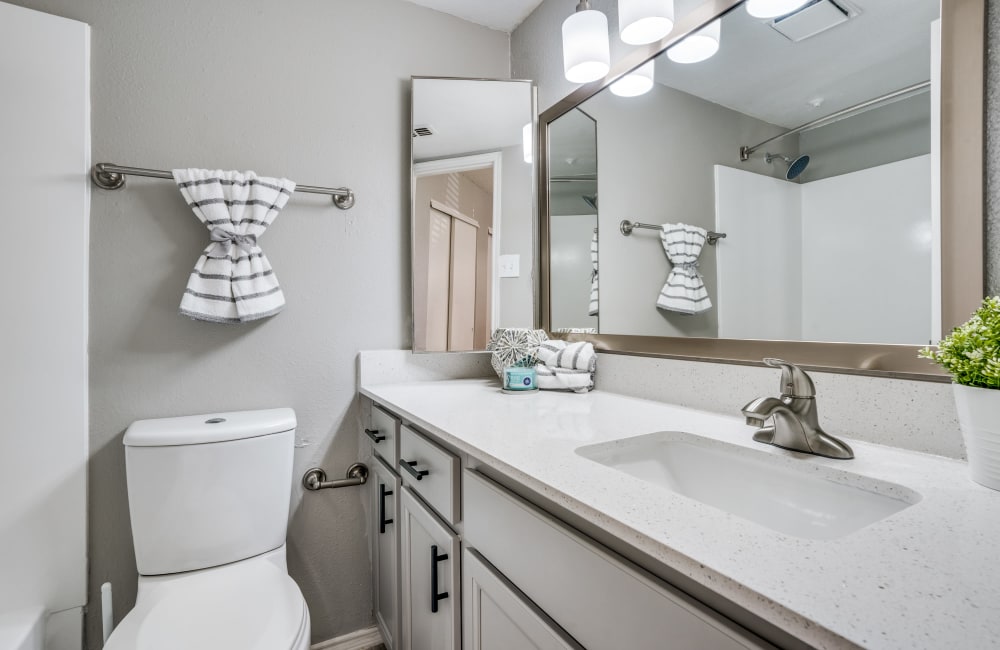 Bathroom with nice counters at Mateo Apartment Homes in Arlington, Texas