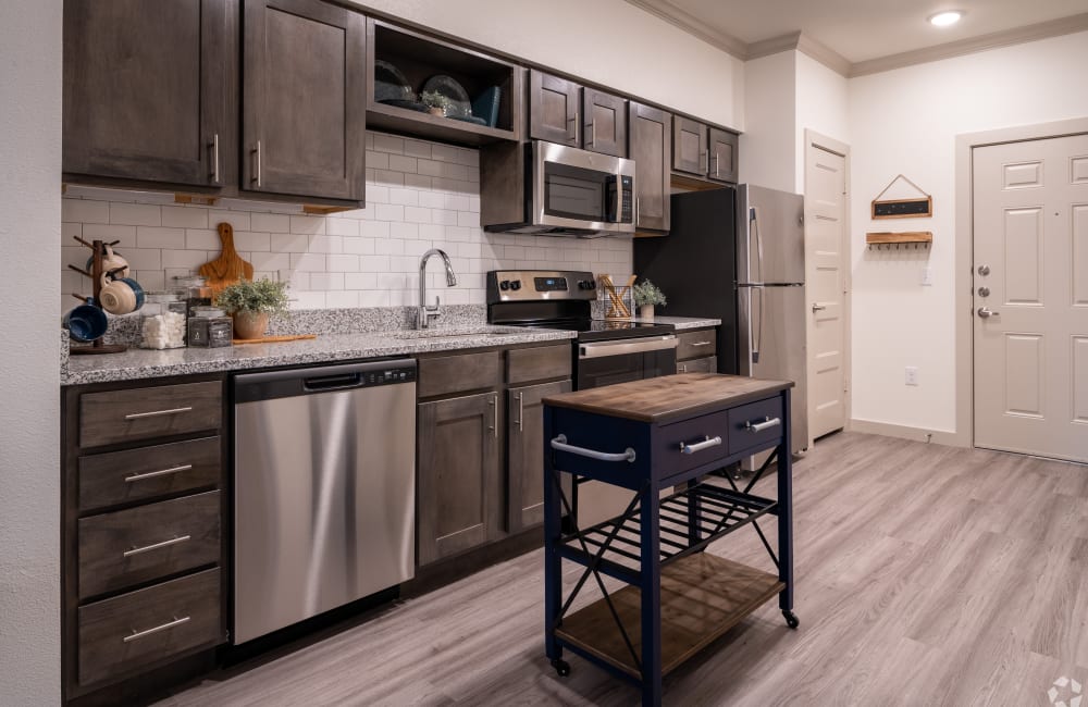 Kitchen with modern appliances at The Preserve at Willow Park in Willow Park, Texas