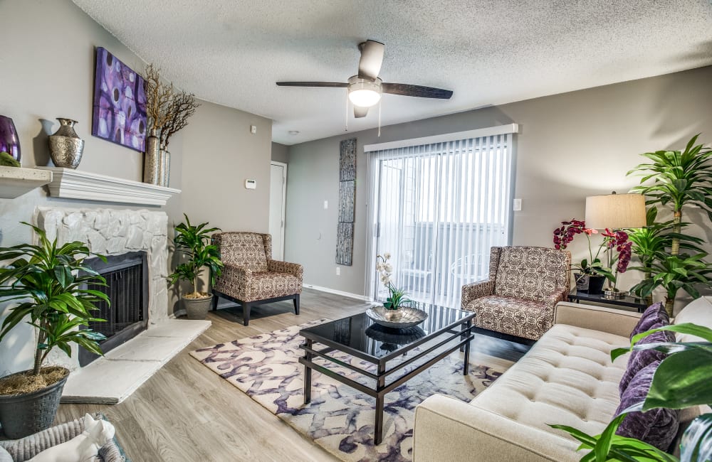 Living room with plants at Sagamore Apartment Homes in Benbrook, Texas