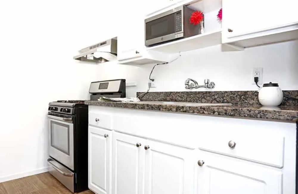 Kitchen with white cabinets at Academy Lane Apartment Homes in Davis, California