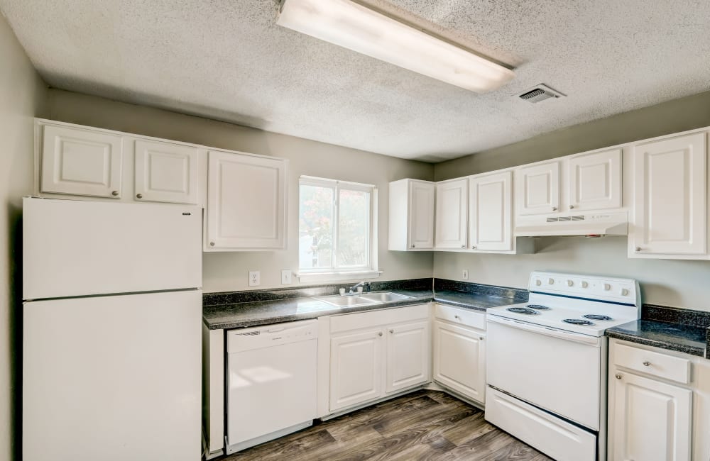 White appliances in an apartment kitchen at The Park at Northside in Macon, Georgia