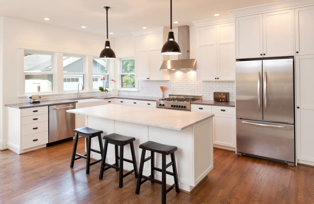 Kitchen with new cabinetry and stainless-steel appliances at El Macero Apartments in Davis, California