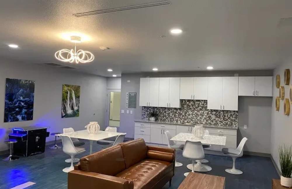 A beautiful living room with couch and coffee tables at The Atrium at Victorian Square in Sparks, Nevada