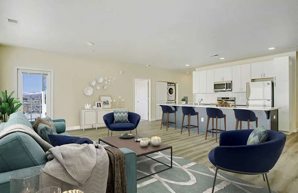  Kitchen with island and bar stools, refrigerator, microwave and wood cabinetry at The Atrium at Victorian Square in Sparks, Nevada