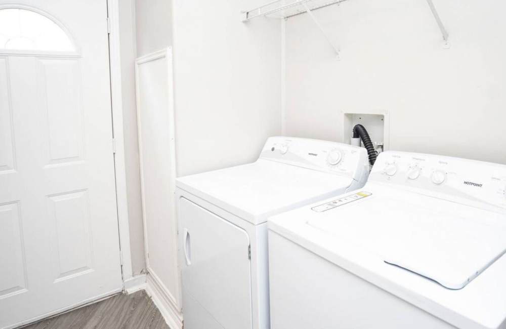 Laundry area of community at Waterstone Place Apartments in Stafford, Texas 