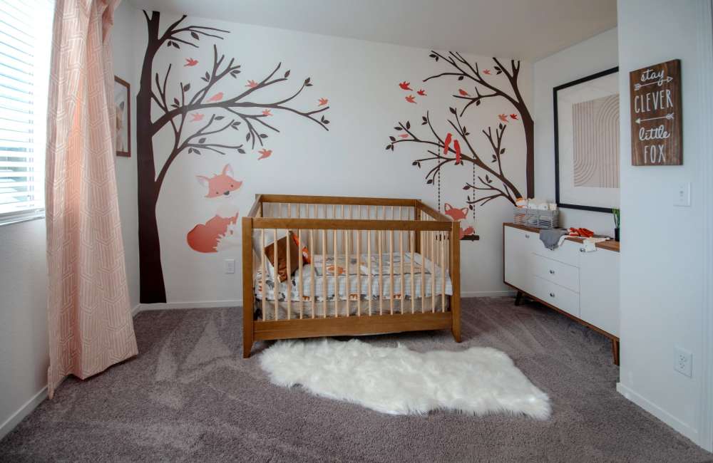A decorated room with a crib in it at Aspen Vista at Anchor Pointe in Reno, Nevada
