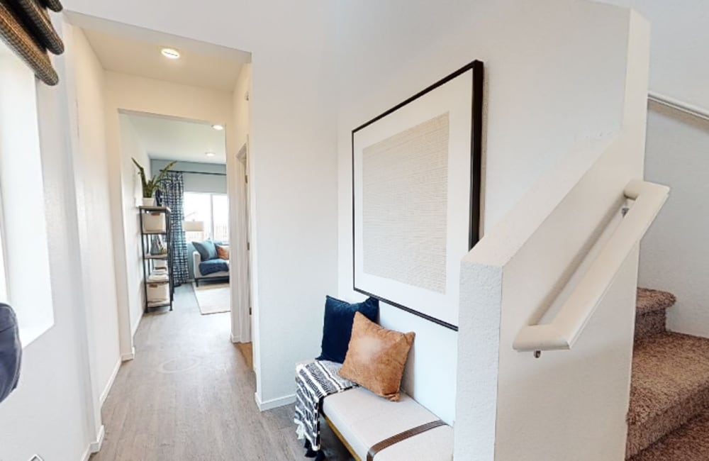 A hallway leading to the stairs in a home at Aspen Vista at Anchor Pointe in Reno, Nevada