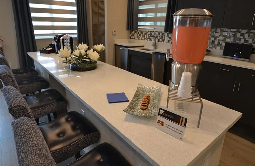 Kitchen with breakfast counter at Edge at Town Center in Jacksonville, Florida