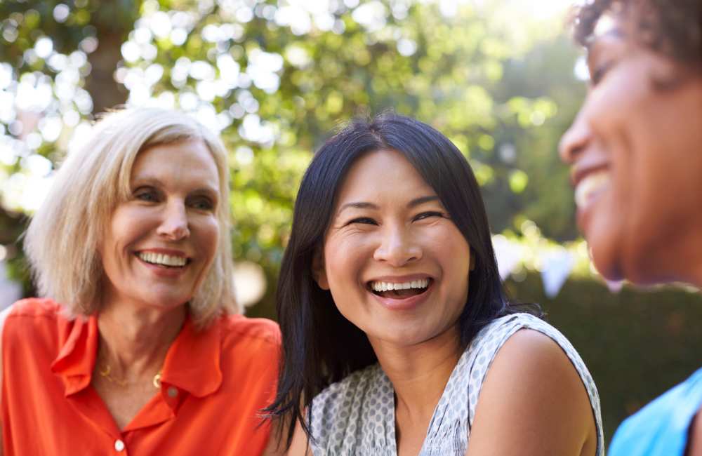 Resident friends gathering at Evergreen Park Townhomes and Apartments in Lansing, Michigan