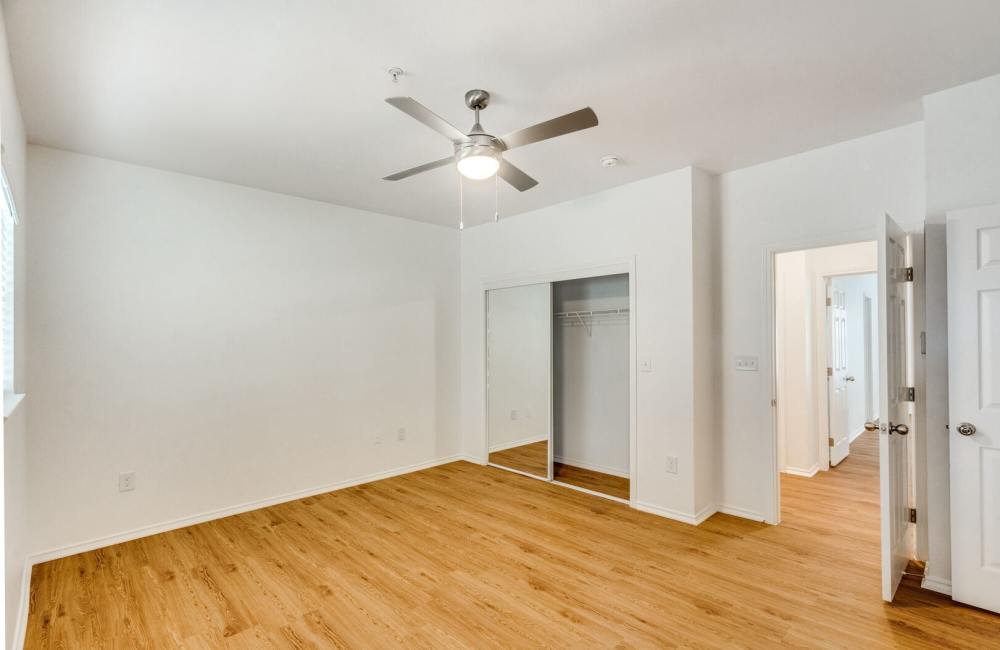Spacious bedroom with connected bathroom at Spicewood Crossing in Carrollton, Texas