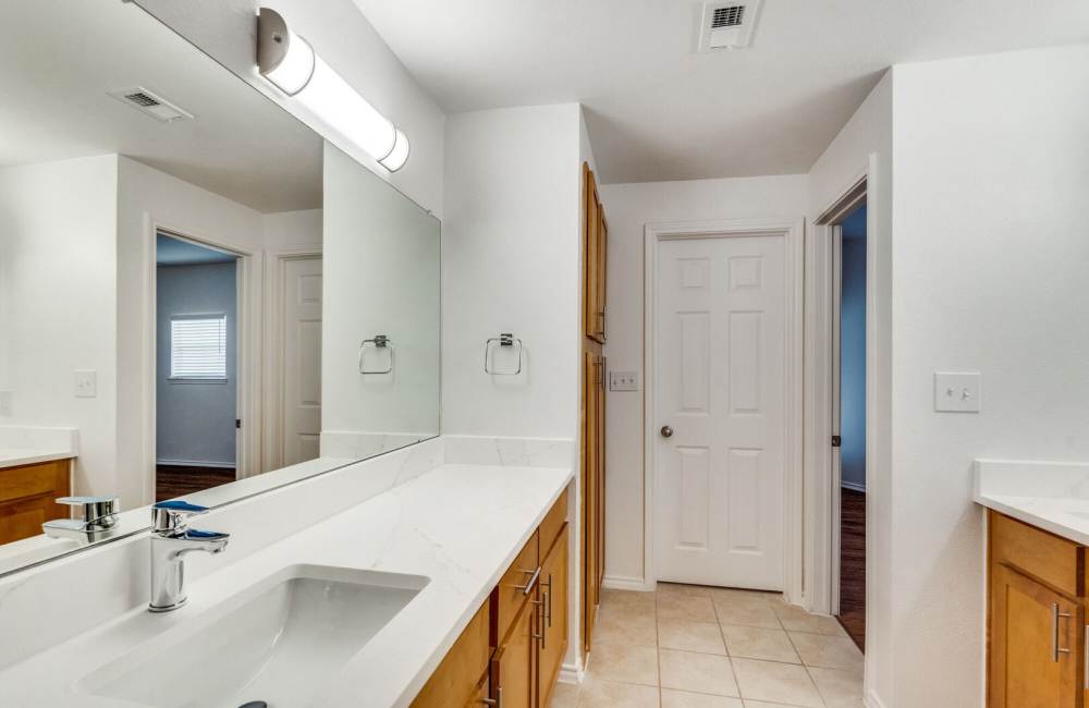 Bathroom with lot of lighting and storage spaces at Spicewood Crossing in Carrollton, Texas