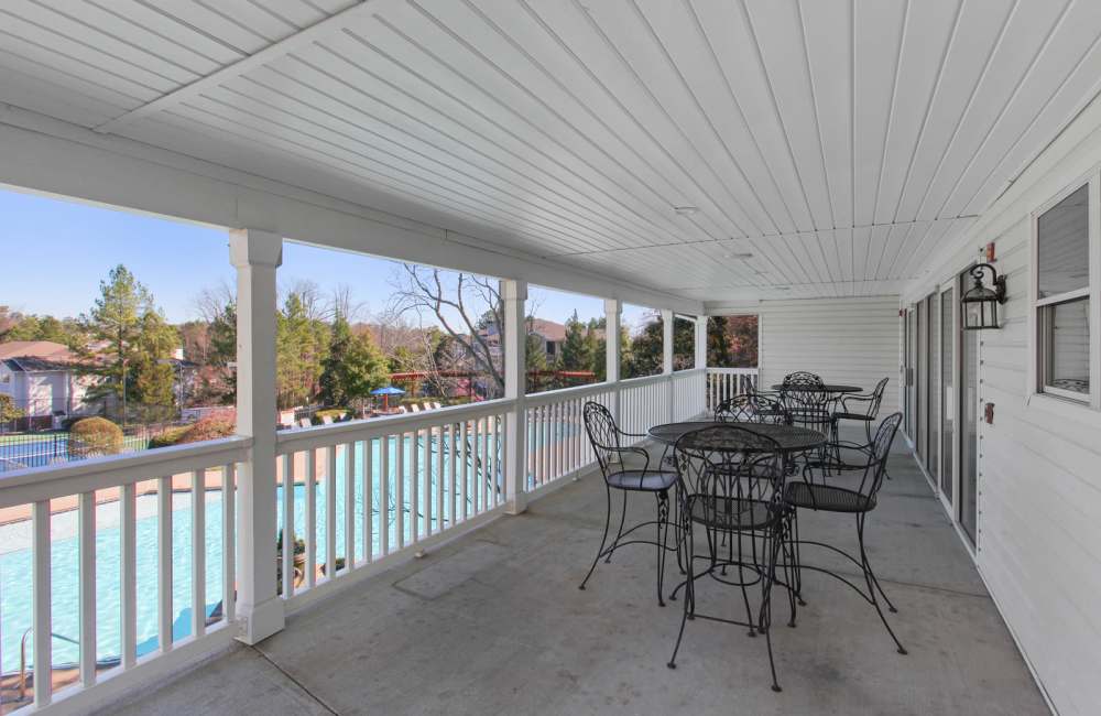 Covered patio seating by the pool at Wellington Point in Atlanta, Georgia