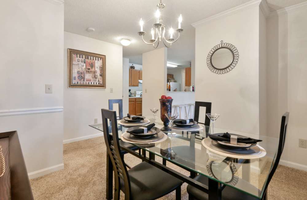 Dining table with hanging light fixture at Carrington Point in Douglasville, Georgia