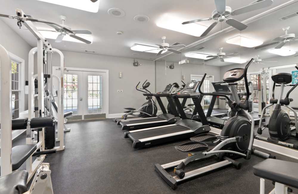 Fitness center with cardio and weight equipment at Carrington Point in Douglasville, Georgia