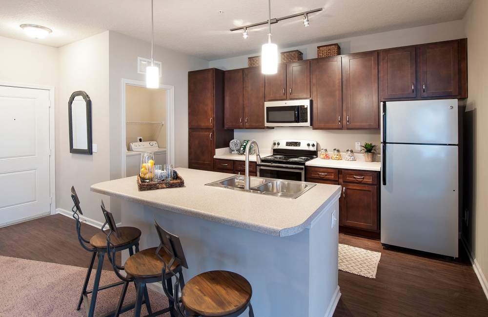 Kitchen with Stainless Steel Appliances at Whitepalm Luxury Apartment Homes in Port Orange, Florida