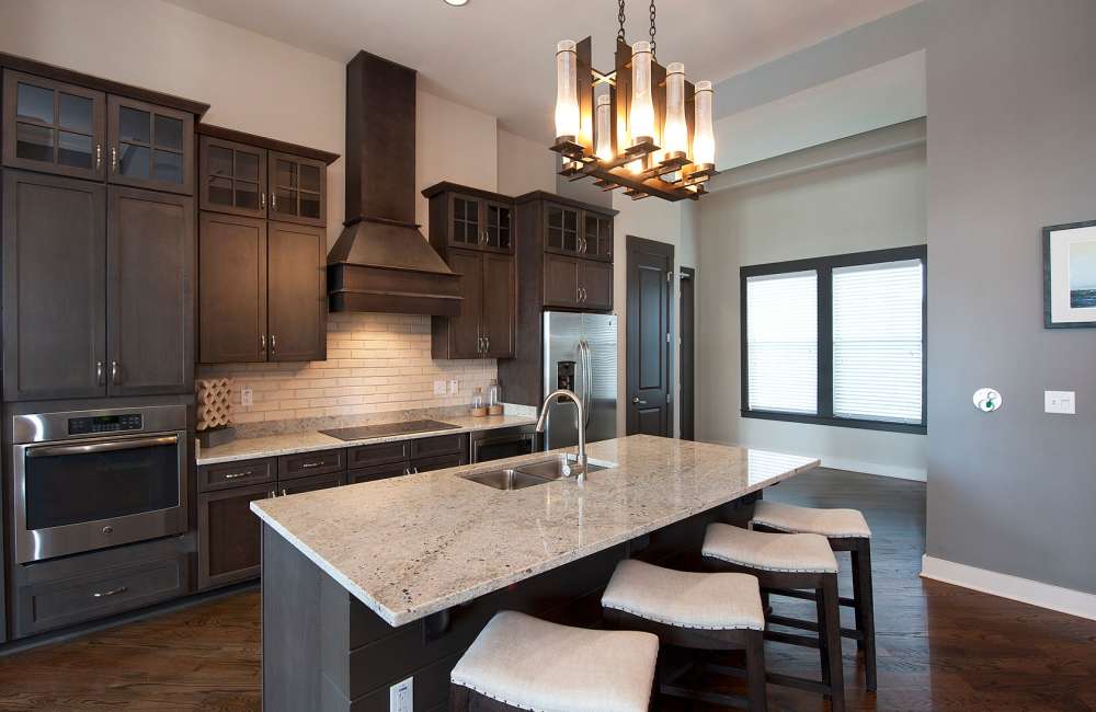 Equipped Kitchen with Designer Countertops at Whitepalm Luxury Apartment Homes in Port Orange, Florida