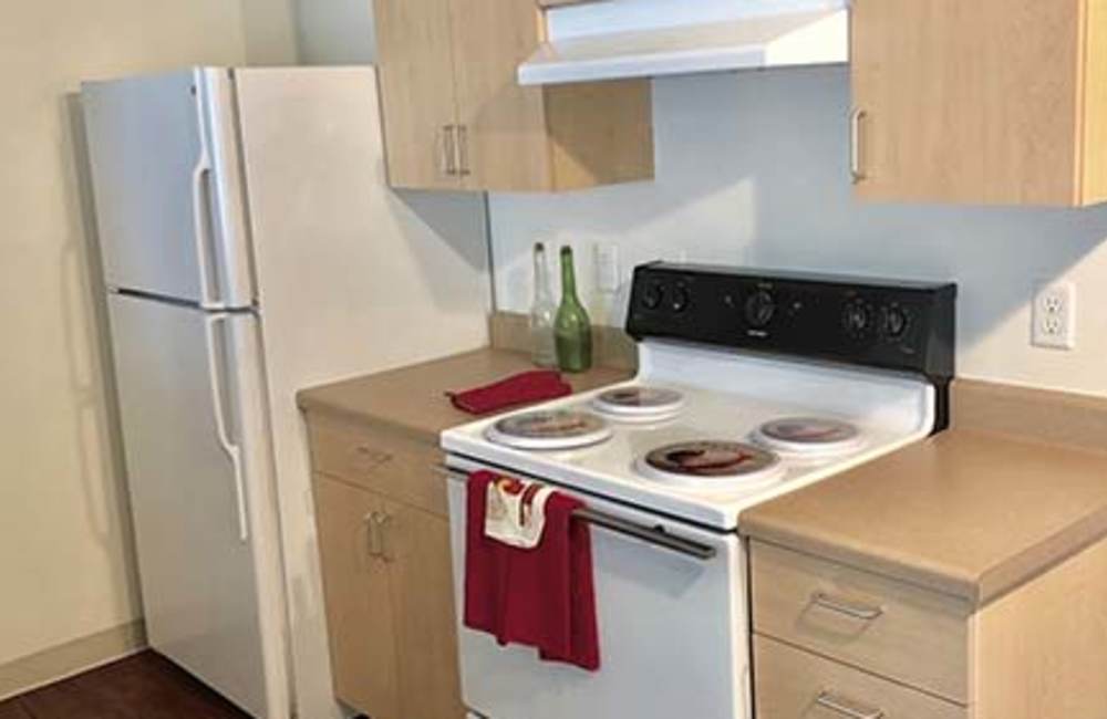 Fully-equipped kitchen at Heron Creek Apartments in Moses Lake, Washington