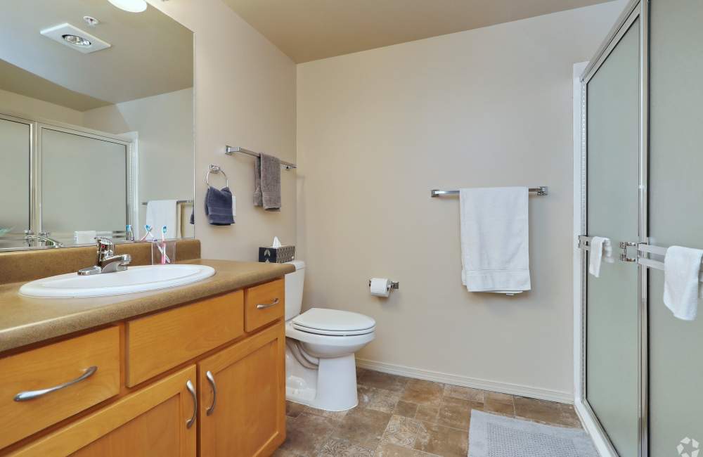 Bright bathroom with shower at The Blakely in Shoreline, Washington