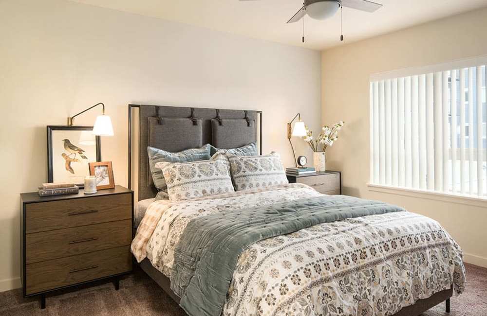 Well-lit and spacious bedroom with ceiling fan at Traditions at Federal Way in Federal Way, Washington