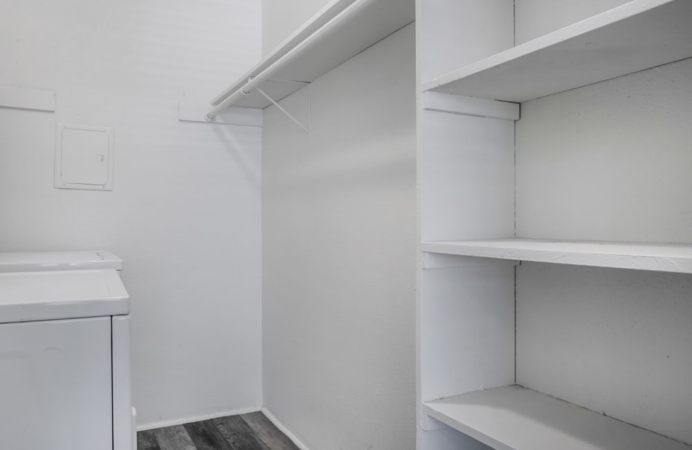 Walk-in closet with multiple shelves at Rayfords Edge Apartments in Spring, Texas Friday, November 15