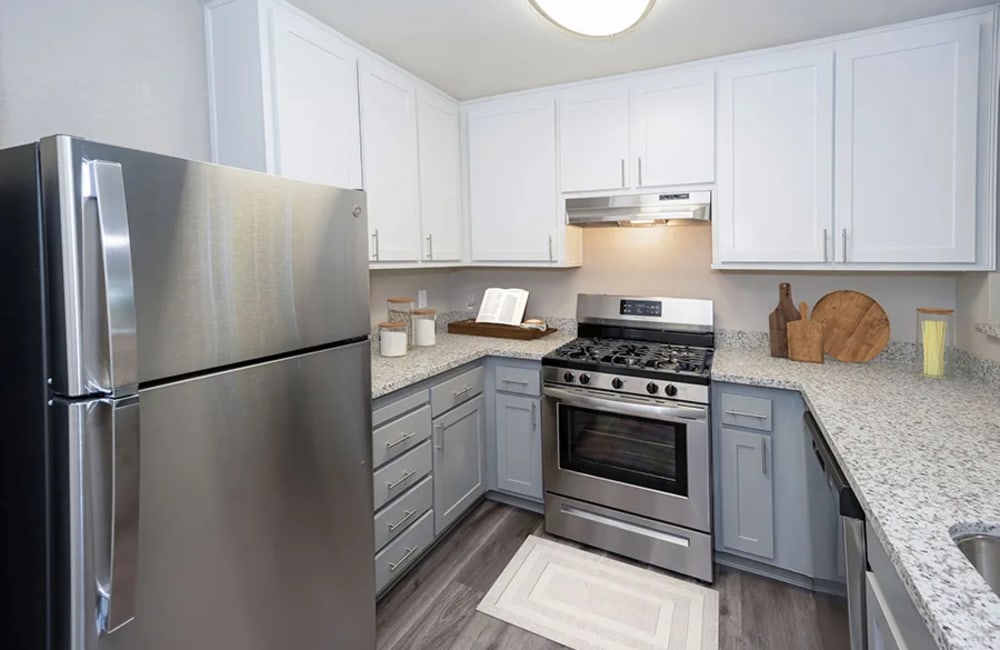 Kitchen with granite countertops at Gateway Apartments in San Leandro, California