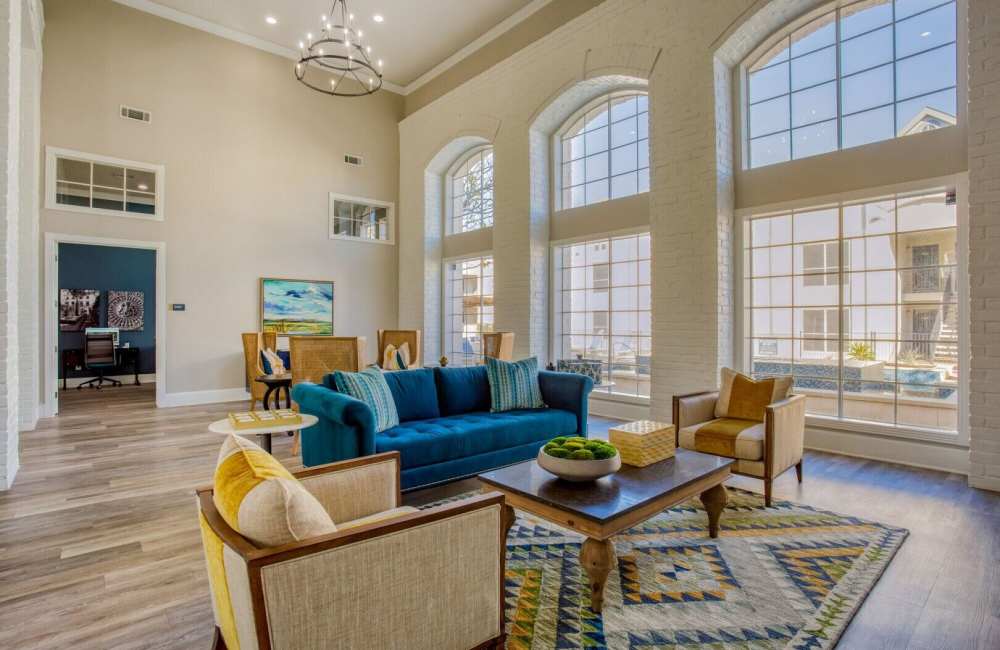 Clubhouse with large seating and hard-wood style flooring at Verlaine on the Parkway in Dallas, Texas, 
