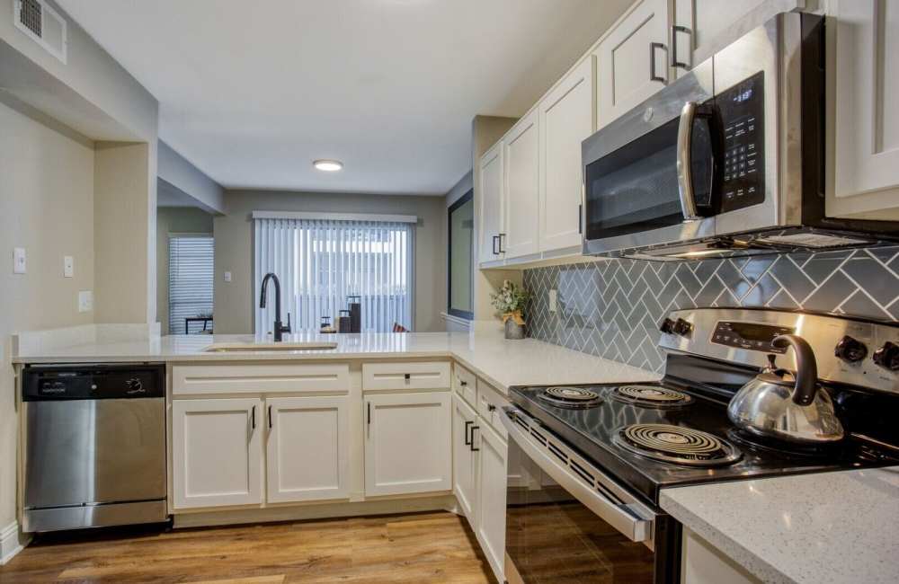 Kitchen with stainless-steel appliances at Verlaine on the Parkway in Dallas, Texas, 
