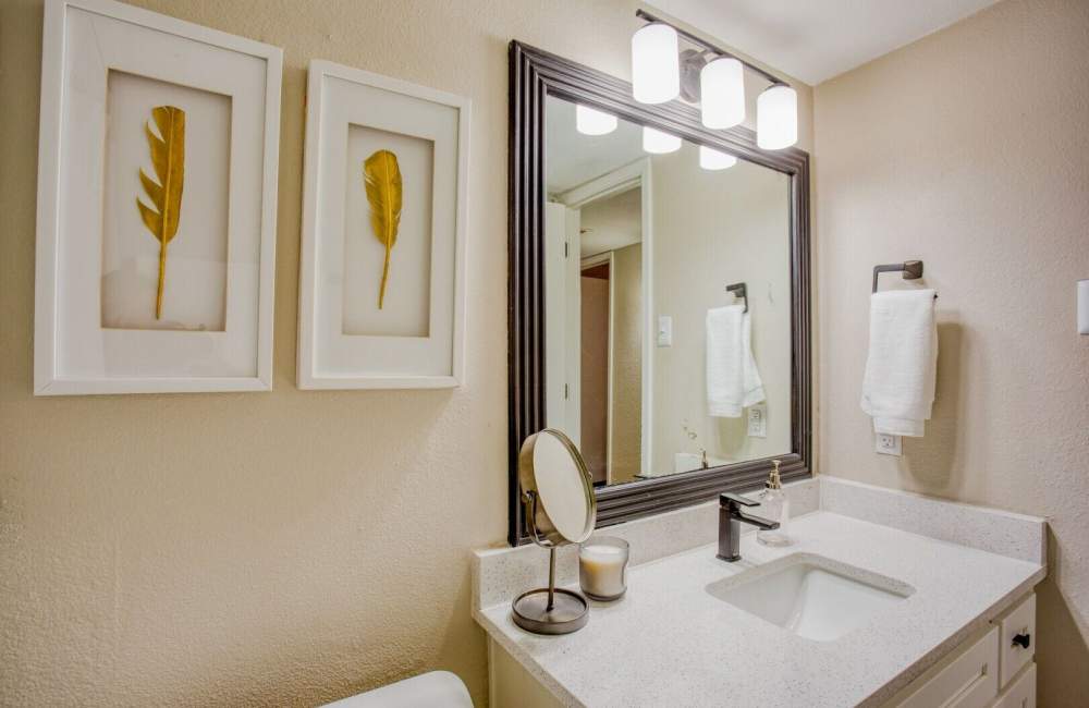 Apartment bathroom with ambient lighting at Verlaine on the Parkway in Dallas, Texas, 