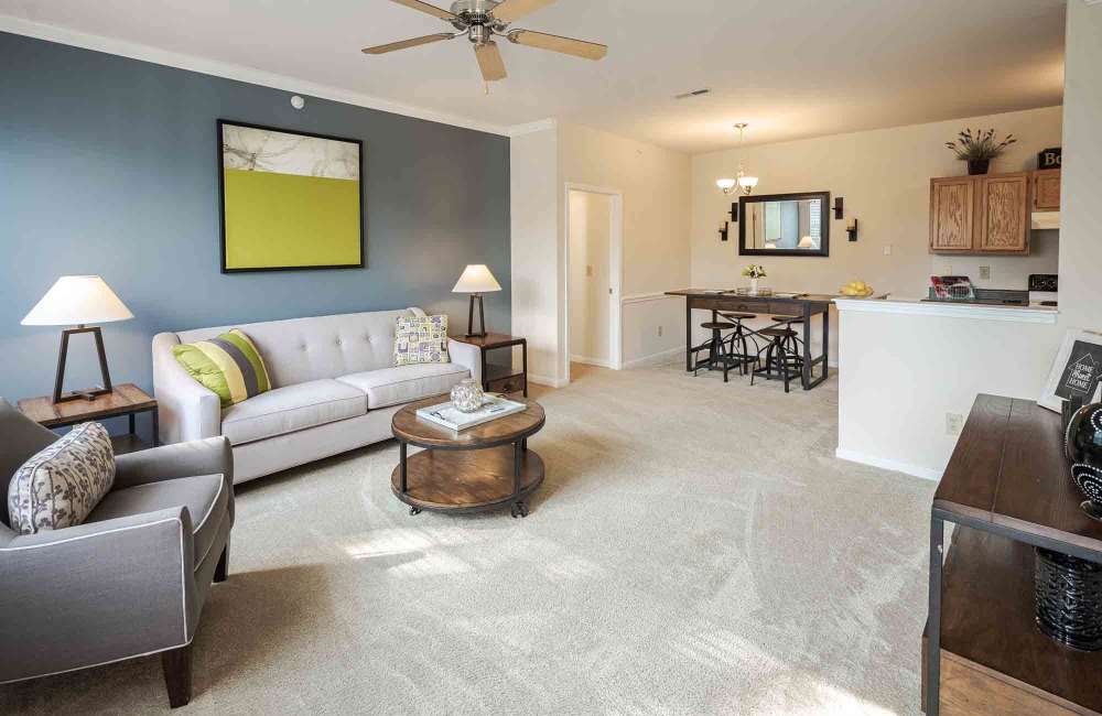 Living room with grey color sofa at Charleston Pines Apartment Homes in Florence, Kentucky