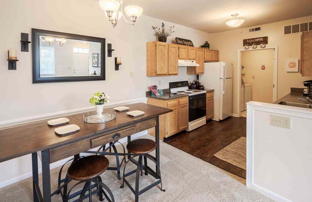 Kitchen and dining area in a home at Charleston Pines Apartment Homes in Florence, Kentucky