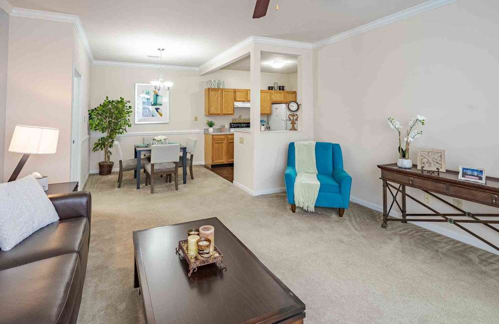Living room and kitchen in an apartment at Aspen Pines Apartment Homes in Wilder, Kentucky