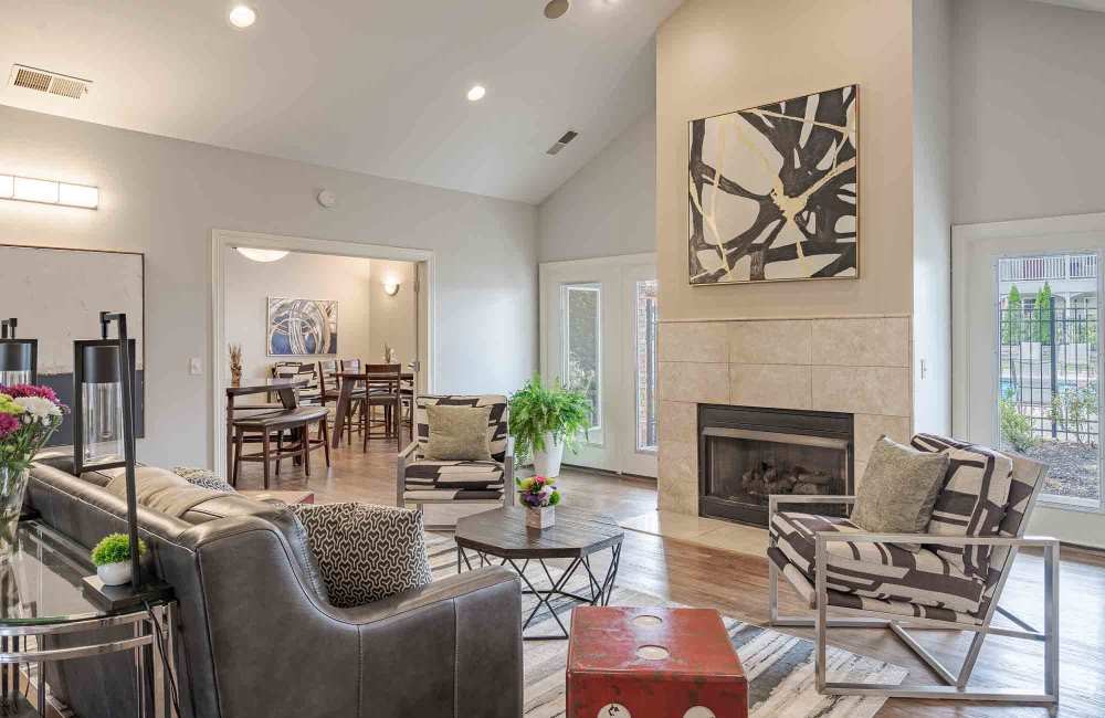 Fireplace and comfortable seating at Aspen Pines Apartment Homes in Wilder, Kentucky