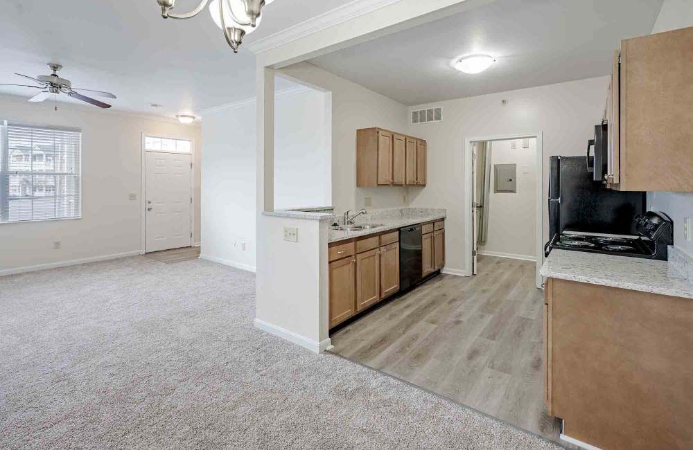 Kitchen with wood-style flooring at Aspen Pines Apartment Homes in Wilder, Kentucky
