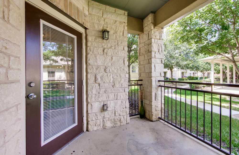 Private balcony with a glass windowed door at The Forum at Grand Prairie in Grand Prairie, Texas, 