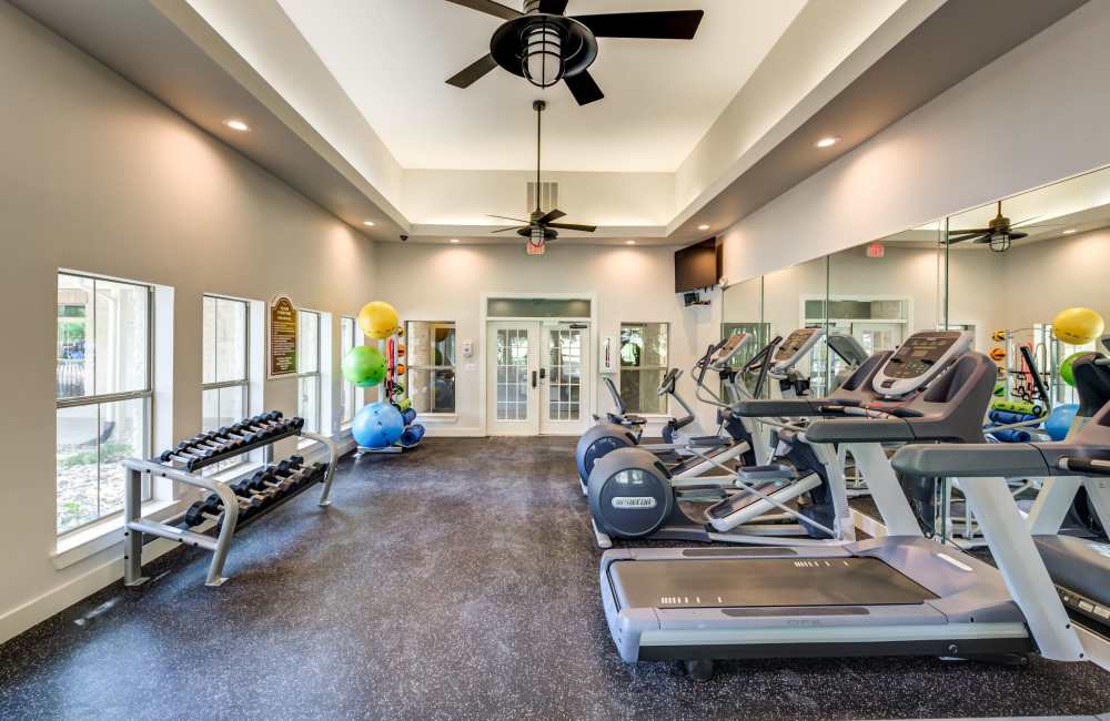 Fitness studio with treadmills and weight machines at The Forum at Grand Prairie in Grand Prairie, Texas, 
