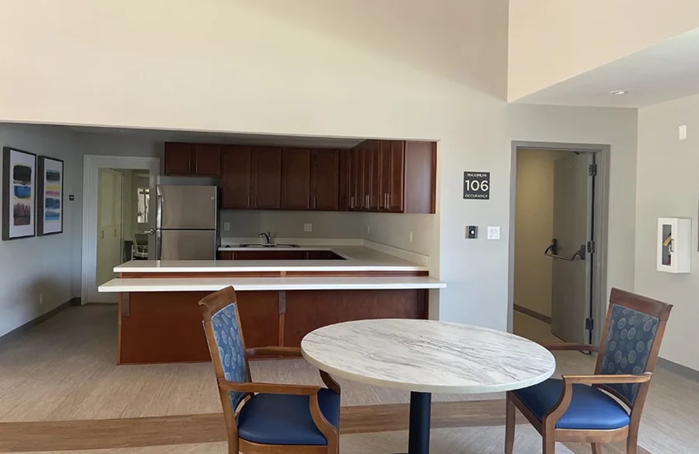 Resident lounge with kitchen at Kernwood Terrace in Los Angeles, California