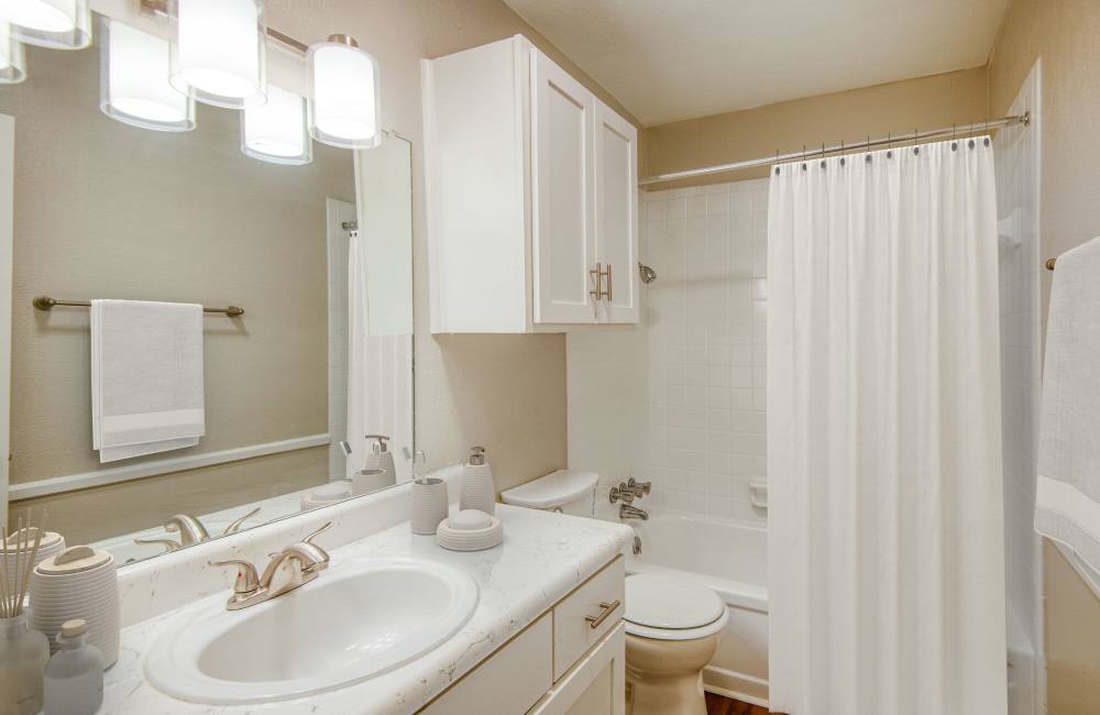 Bathroom with large mirror and pendant lighting at Lakeridge Heights in Dallas, Texas, 